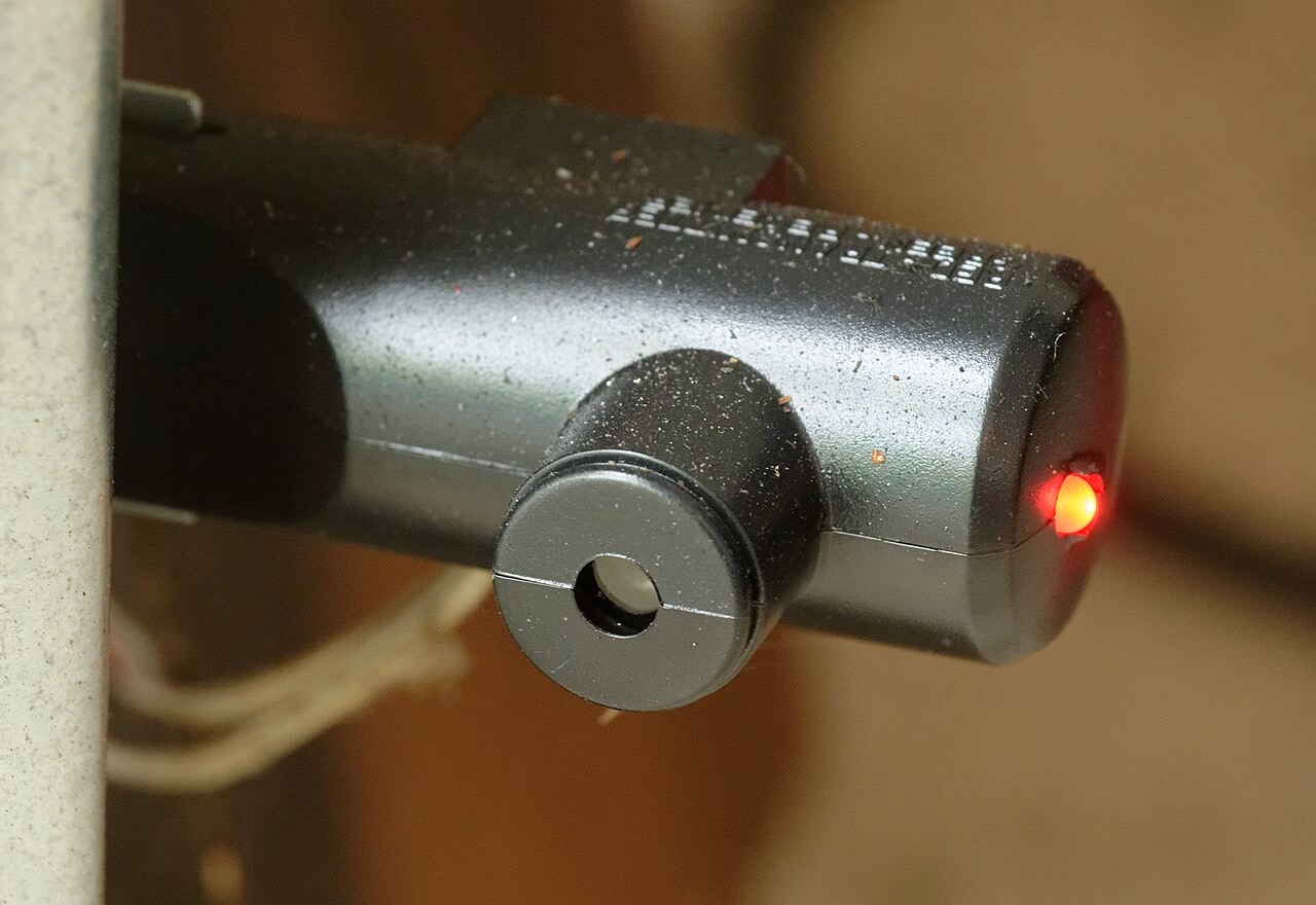 Garage door safety sensor near the floor